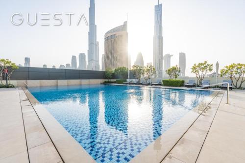 a swimming pool on the roof of a skyscraper at Downtown Views I - Burj Khalifa View, Downtown Dubai in Dubai