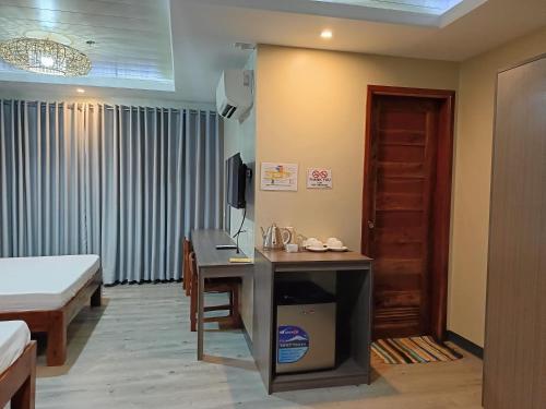 Postel nebo postele na pokoji v ubytování Norlu Cedec Midpoint Hotel