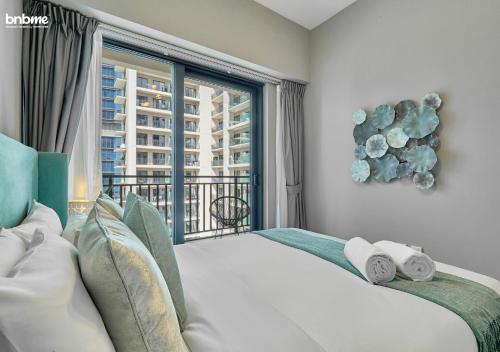a bedroom with a large bed with a large window at bnbmehomes - Business Bay Beauty w/ City Views - 1816 in Dubai