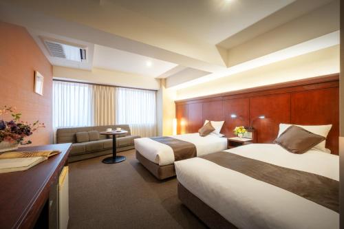 Ένα ή περισσότερα κρεβάτια σε δωμάτιο στο Niigata Grand Hotel