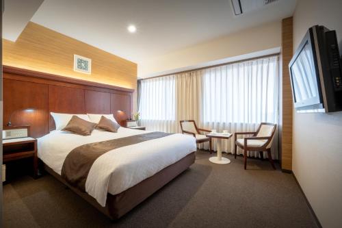 Ένα ή περισσότερα κρεβάτια σε δωμάτιο στο Niigata Grand Hotel