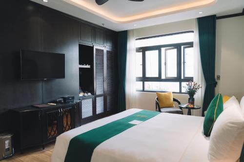 Телевизор и/или развлекательный центр в Goldient Boutique Hotel