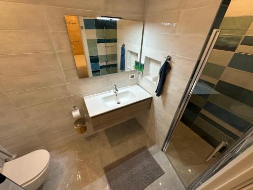 a bathroom with a sink and a mirror at B&B Casa Limone in Limone sul Garda