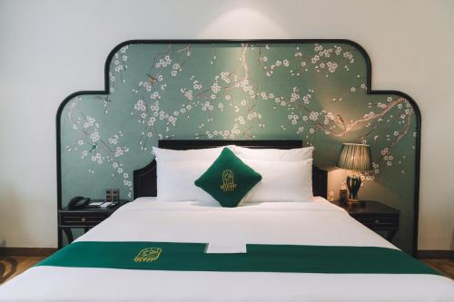 Кровать или кровати в номере Goldient Boutique Hotel