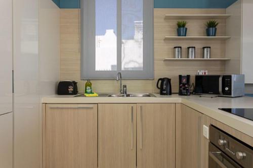 Cuisine ou kitchenette dans l'établissement Waters-Edge Complex