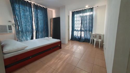 Postel nebo postele na pokoji v ubytování DRA Guesthouse