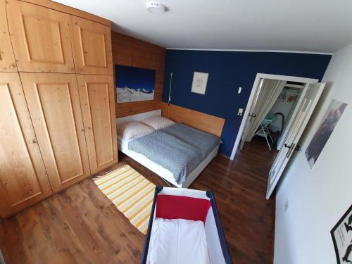 a small bedroom with a bed and a closet at Apartment Gertrude in Sankt Johann in Tirol
