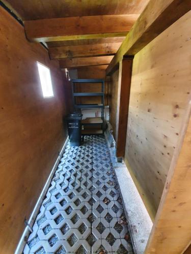 an inside view of a room with a hallway with a floor at Apartment Gertrude in Sankt Johann in Tirol