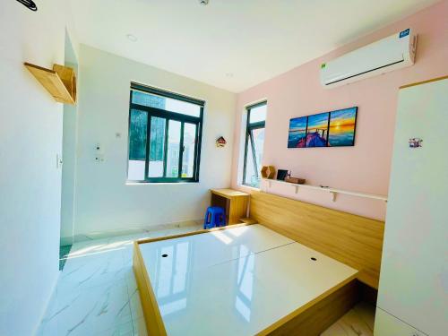 a room with a glass table and a window at Koala1 Apartment in Vung Tau