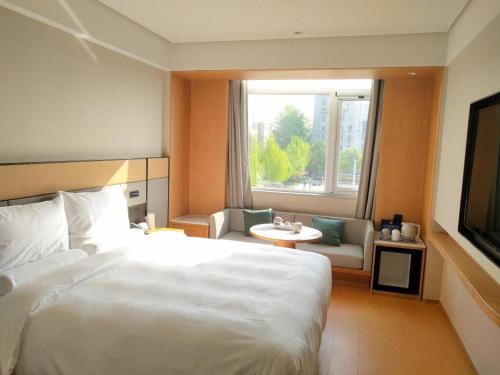 Ji Hotel Beijing Shangdi Nongda Nan Road房間的床