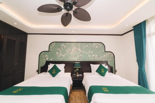 Кровать или кровати в номере Goldient Boutique Hotel