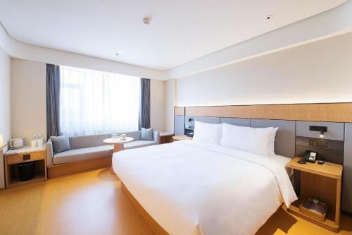 Ein Bett oder Betten in einem Zimmer der Unterkunft Ji Hotel Changchun Xi'an Avenue