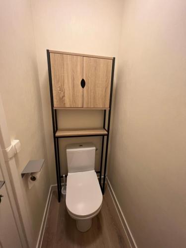a small bathroom with a toilet in a room at Chez Olivia in Melle