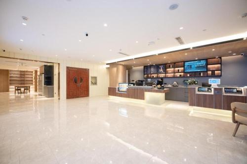 Lobby alebo recepcia v ubytovaní Hanting Hotel Jinan International Expro Center