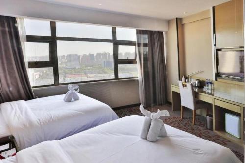 Posteľ alebo postele v izbe v ubytovaní Starway Hotel Zijinshan Provincial People's Hospital