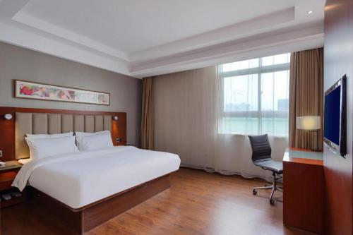 เตียงในห้องที่ Hanting Hotel Nanjing Jingwu Road Hongyang Furniture Centre