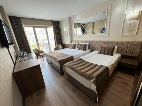 Un ou plusieurs lits dans un hébergement de l'établissement The Hotel Beyaz Saray & Spa - Special Category