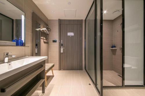 Ванная комната в Hanting Hotel Wuhan Jianghan Road Pedestrian Street