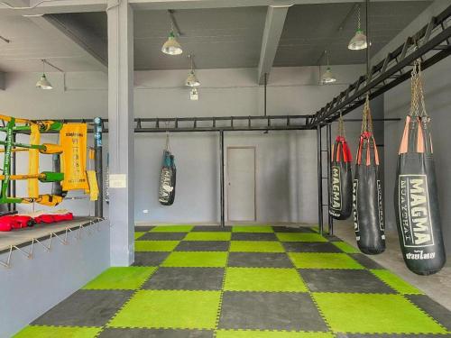 a gym room with a checkered floor at NATTHAWAN POOL ACCESS in Rawai Beach