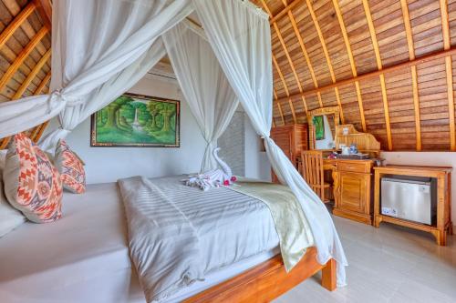 Postel nebo postele na pokoji v ubytování Bagia Bungalows