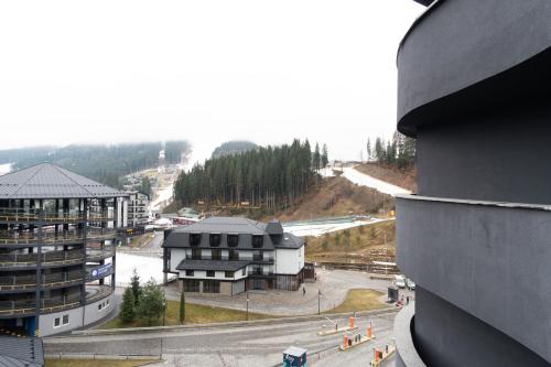 arial view of a building and a street with a building at SAVOIE Apartments Bukovel in Bukovel
