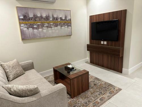 TV o dispositivi per l'intrattenimento presso Quiet Dreams - Serviced Apartments Al-Nour Branch
