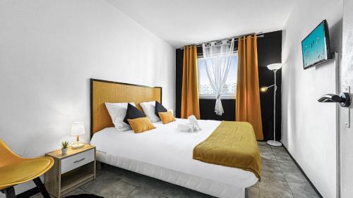 a bedroom with a large bed and a window at Homey Savignat Aux portes de Paris in Créteil