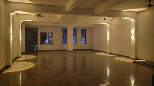 an empty room with white walls and floors and windows at Hotel Neelkanth Prime Retreat, Kekri in Kekri