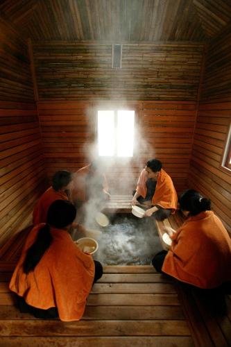 a group of people cooking in a sauna at Eldorado Resort in Sinan
