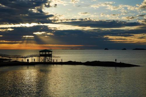 a group of people standing on a small island in the water at Eldorado Resort in Sinan