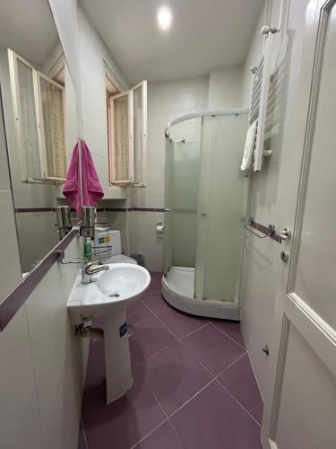 a bathroom with a sink and a shower at Belgrade Epicenter in Belgrade