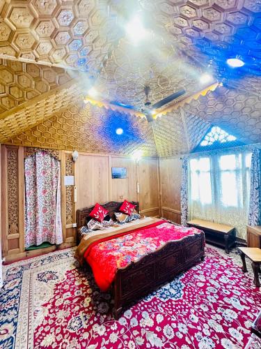 a bedroom with a bed in a room with a ceiling at Houseboat New world in Srinagar