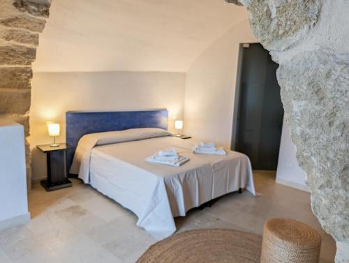 Ένα ή περισσότερα κρεβάτια σε δωμάτιο στο Case al Borgo - Albergo diffuso