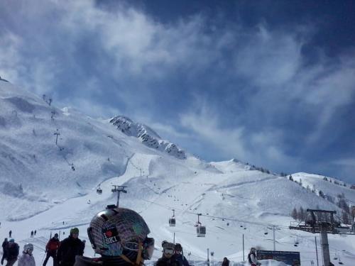 a group of people on a ski slope with a ski lift at Grand Roc in Chamonix