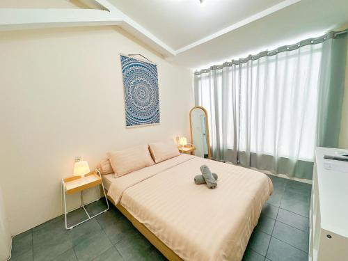 Postel nebo postele na pokoji v ubytování OsCo Paviliun