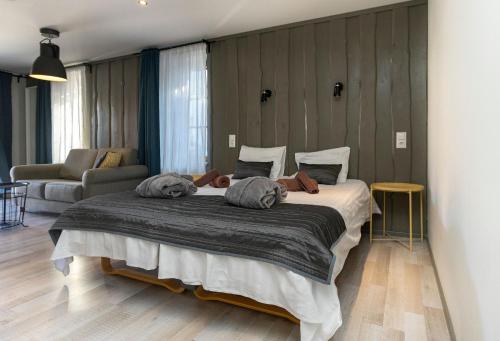 Postel nebo postele na pokoji v ubytování Johan Suites & Spa