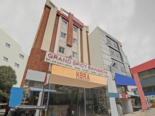 um edifício com uma placa na frente dele em Townhouse Hotel Nera Regency Near Image Hospital em Kondapur