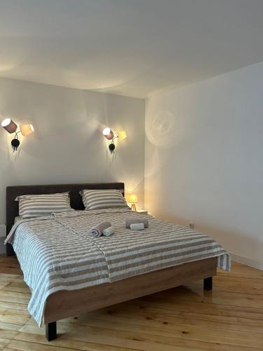 a bedroom with a large bed with two pillows at Kosancic No.1 in Belgrade
