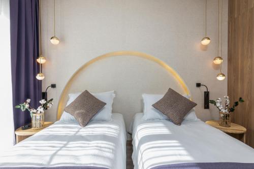 two beds sitting next to each other in a room at Ema Houses in Antalya