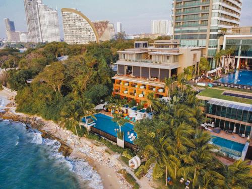 an aerial view of a resort and the ocean at Cape Dara Resort - SHA Plus in Pattaya North