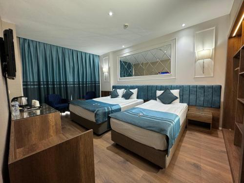 Un ou plusieurs lits dans un hébergement de l'établissement The Hotel Beyaz Saray & Spa - Special Category