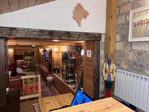 a room with a desk with a laptop on a table at Chalet Kolašin in Kolašin