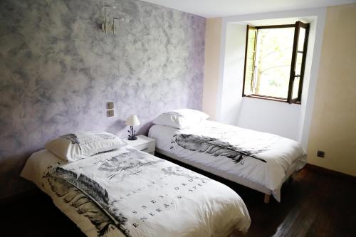 Ένα ή περισσότερα κρεβάτια σε δωμάτιο στο Ardèche maison 12 personnes