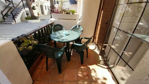 a small table and chairs on a balcony at Casa La Marina in Alcossebre