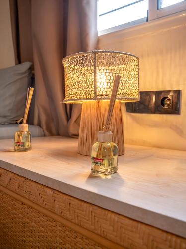 a lamp sitting on top of a table at Aliya Luxury Apartment - LA DUNE - AGADIR in Agadir