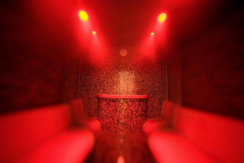 a red room with red lights on a wall at Hotel Hochsauerland 2010 in Willingen