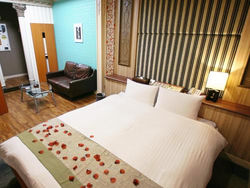 Postel nebo postele na pokoji v ubytování Hotel FirstWood 成田店