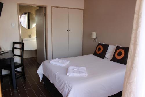 Ένα ή περισσότερα κρεβάτια σε δωμάτιο στο Travel Lodge
