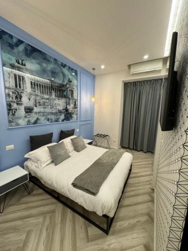 ローマにあるDomus Avi Vaticanoのベッドルーム1室(ベッド1台付)が備わります。壁には絵画が飾られています。