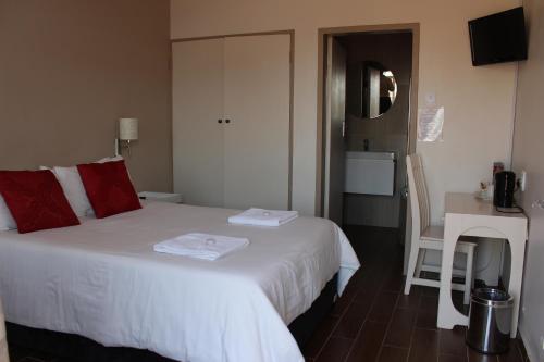 Ένα ή περισσότερα κρεβάτια σε δωμάτιο στο Travel Lodge